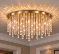 Snowfall Asfour crystal flush mount chandelier in warm brass with illuminated clear octagon crystals